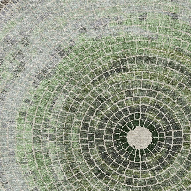 Geometric washable area rug close-up of spiral circular medallion with green center