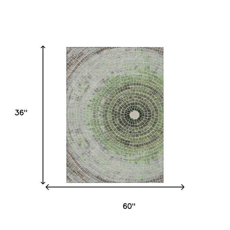 Geometric washable area rug size diagram with circular green-and-gray medallion pattern