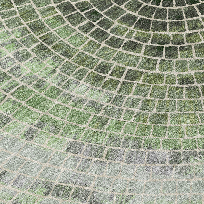 Geometric washable area rug close-up showing brick-like pattern in green and gray