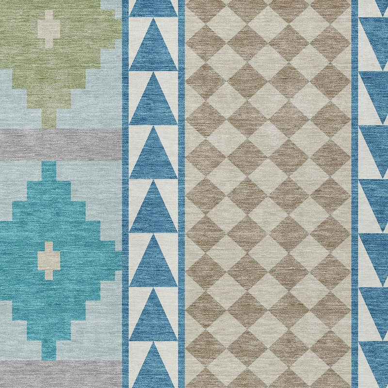 Close-up of teal and ivory southwestern area rug with cross motifs and blue triangle border