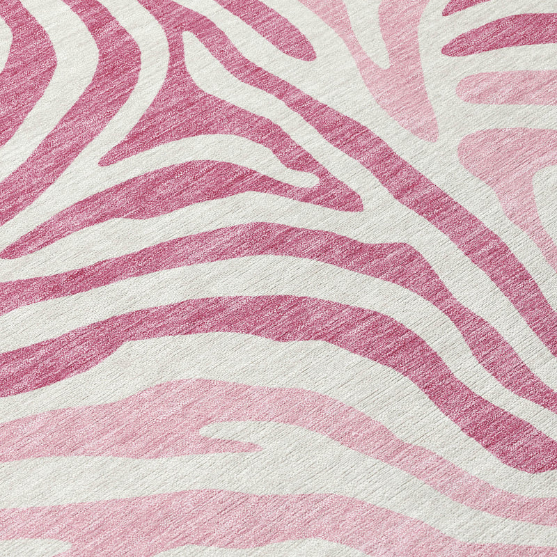 Close-up of pink and ivory zebra stripe pattern area rug