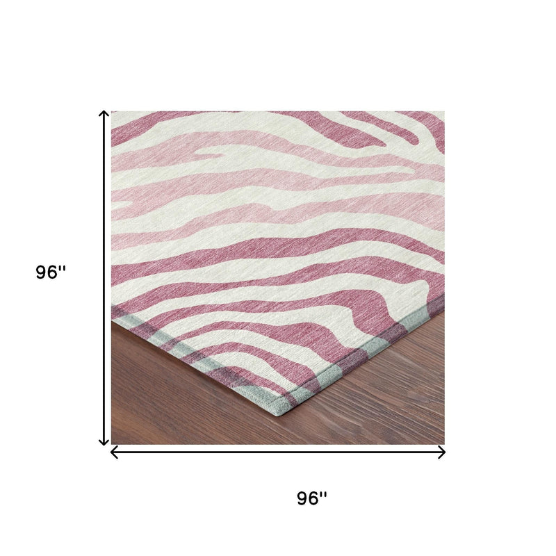 Pink and ivory zebra print area rug, 96 in by 96 in size