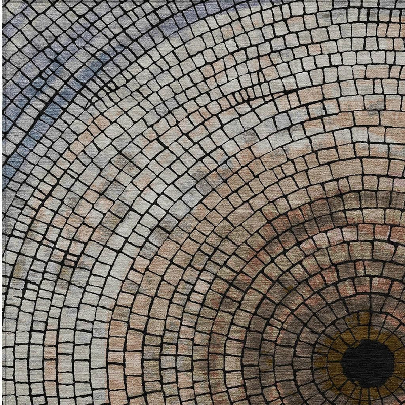 Close-up of beige and taupe geometric mosaic rug with arched concentric brick lines