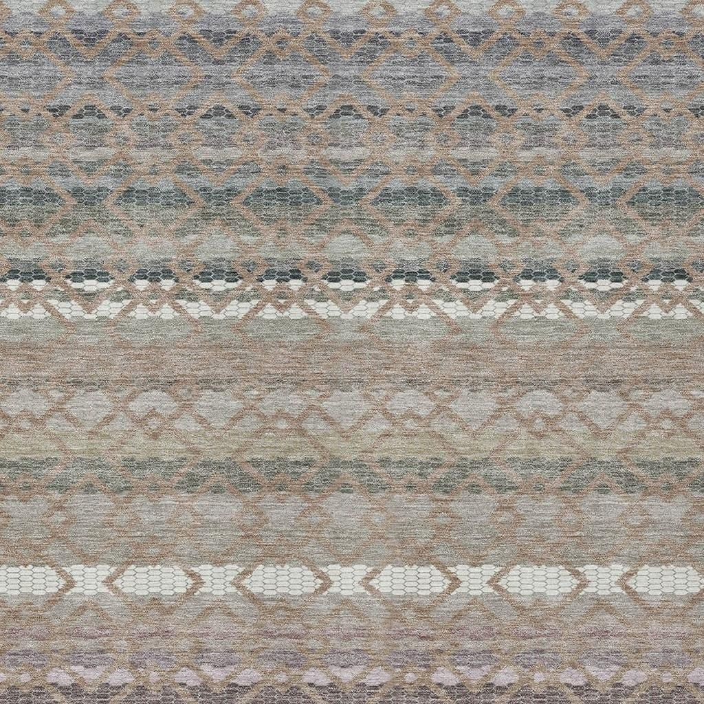 Multi-colored woven area rug with geometric patterns in shades of gray, beige, and subtle pastels.