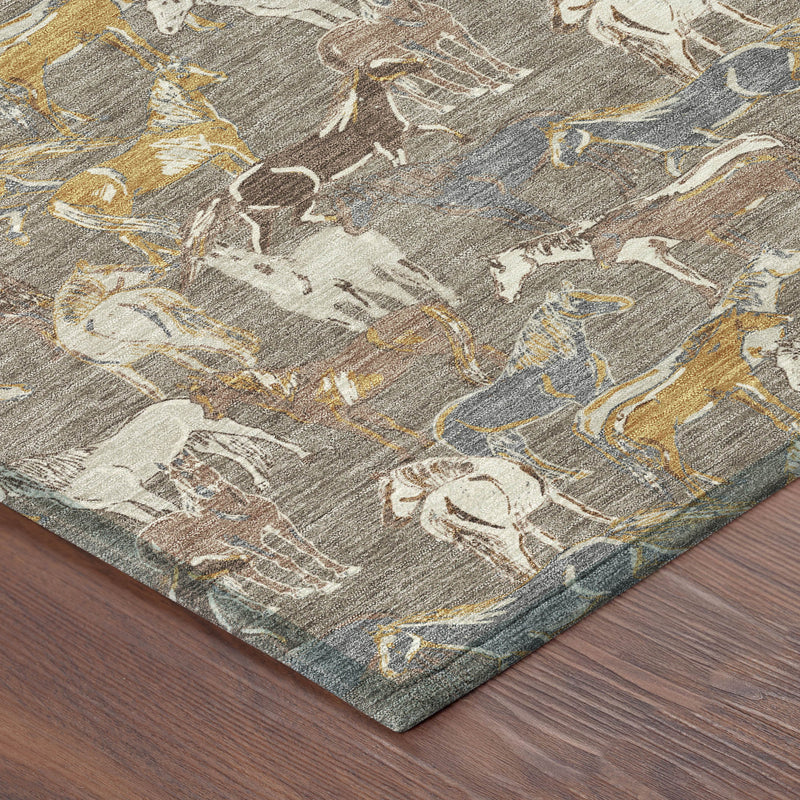 Corner of taupe, gray, and blue horse-pattern indoor/outdoor area rug on wood floor