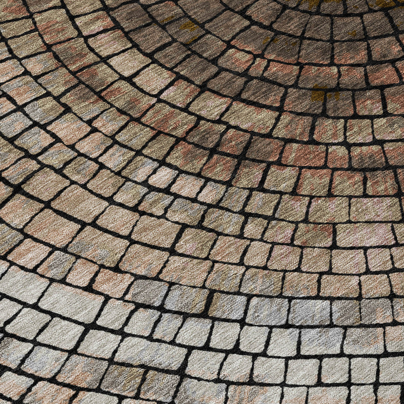 Close-up of rug pile with concentric brick lines in beige, taupe, and dark gray