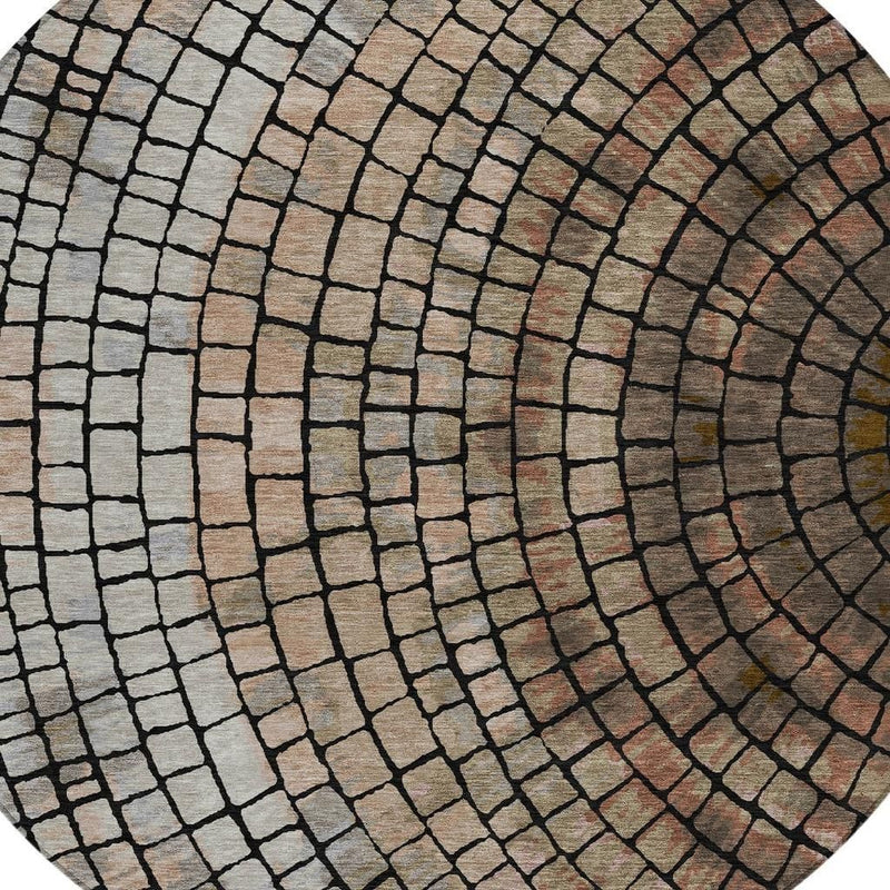 Close-up of round rug with concentric brick geometry in beige, taupe, and dark gray