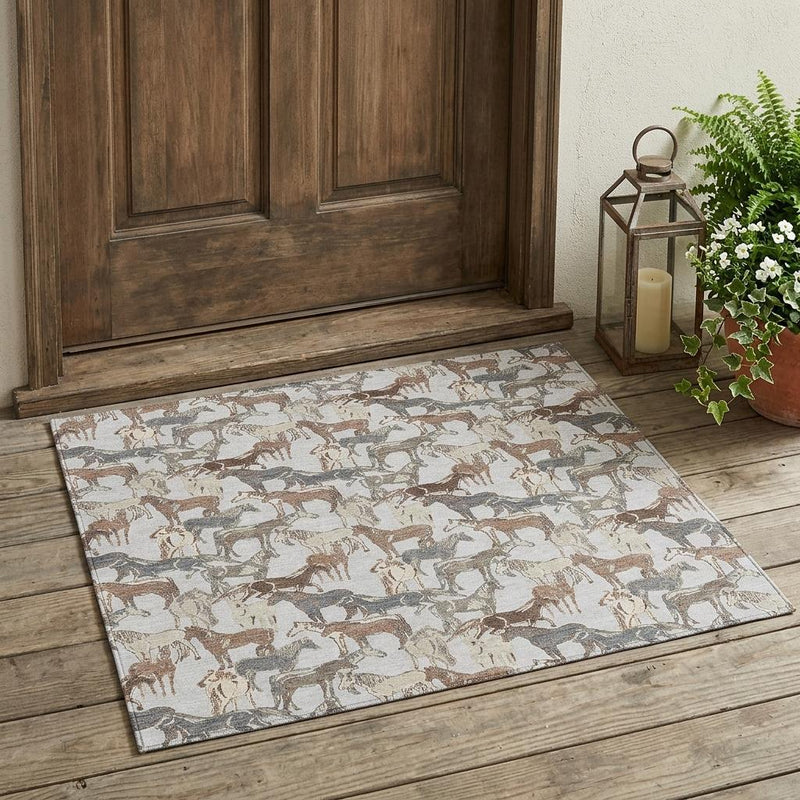 Washable indoor outdoor area rug with scattered horse silhouettes in gray and brown