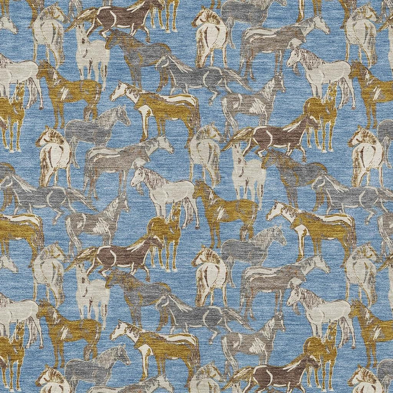 Close-up of horse-pattern area rug in blue with beige and gold motifs