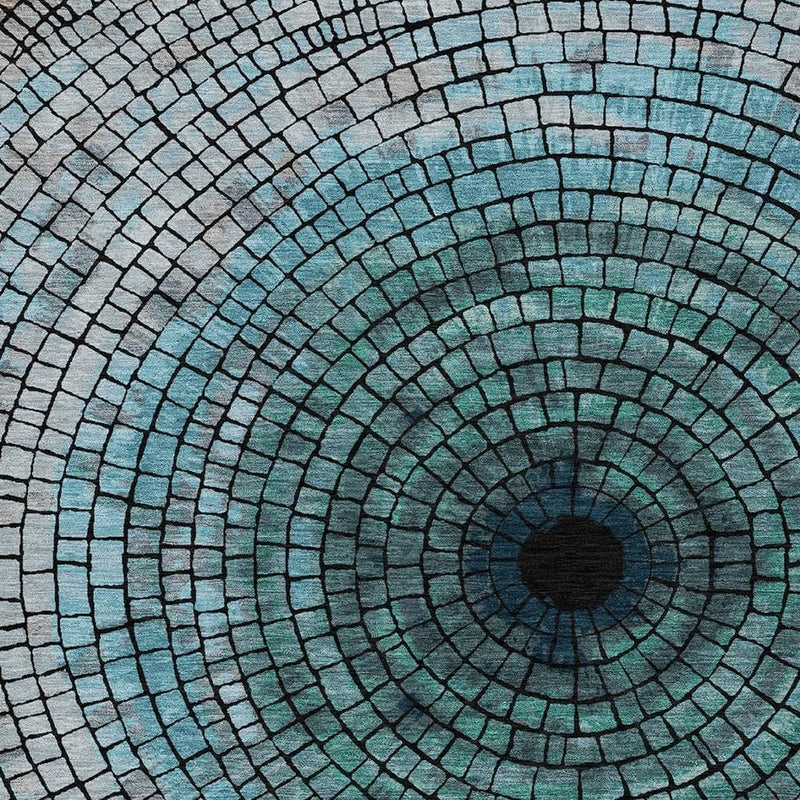 Teal and gray concentric mosaic tile pattern rug with dark circular center
