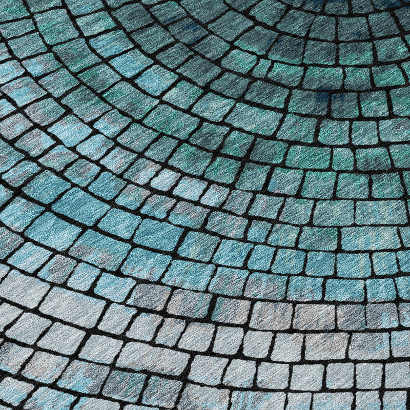 Teal and gray mosaic tile pattern area rug with curved spiral lines