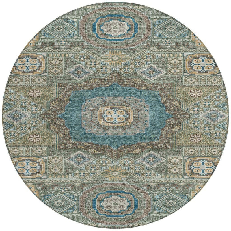 Round oriental area rug with teal blue, green, and tan geometric floral motifs.
