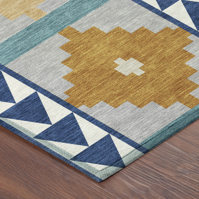 Close-up of round southwestern area rug with blue triangle border and tan cross motifs