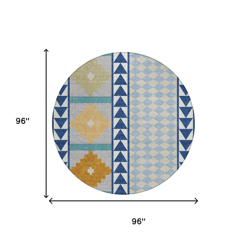 Round geometric area rug with navy, sky blue, and tan patterns; dimensions shown