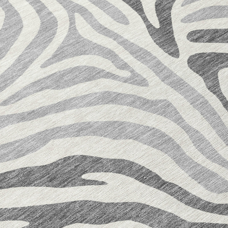 Close-up of gray and ivory zebra pattern on a washable area rug