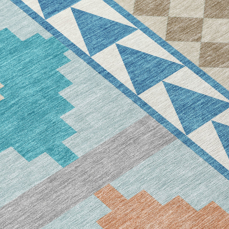 Teal and ivory area rug with blue chevron stripe and cross motifs