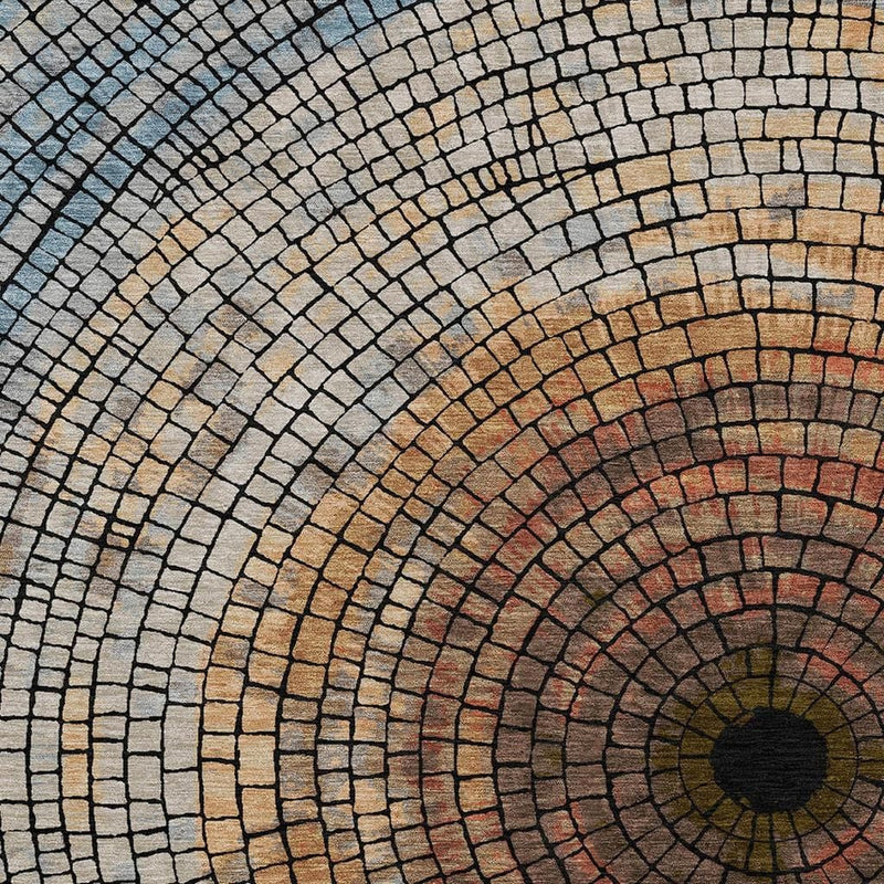 Geometric circular mosaic area rug with concentric brick rings in copper, orange and cream