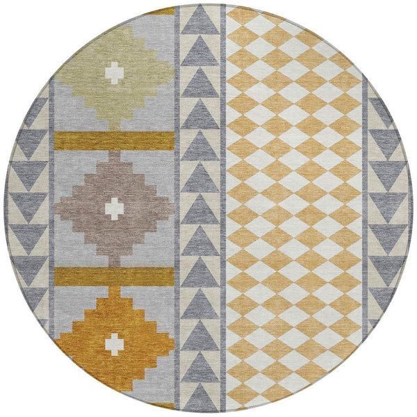 Round area rug with patchwork southwestern pattern in gray, beige, and mustard accents