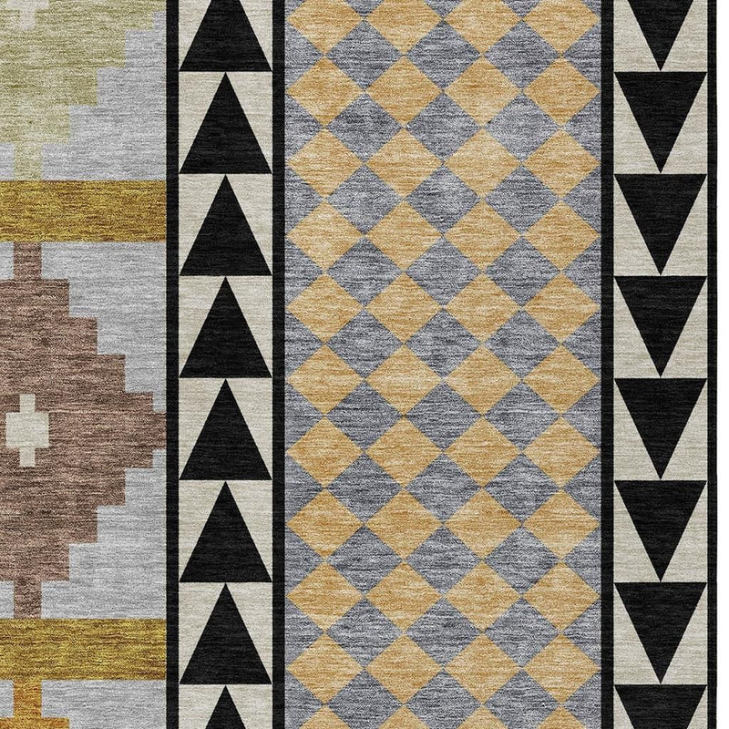 Geometric area rug detail with diamond pattern panel and black border triangles in beige and gray