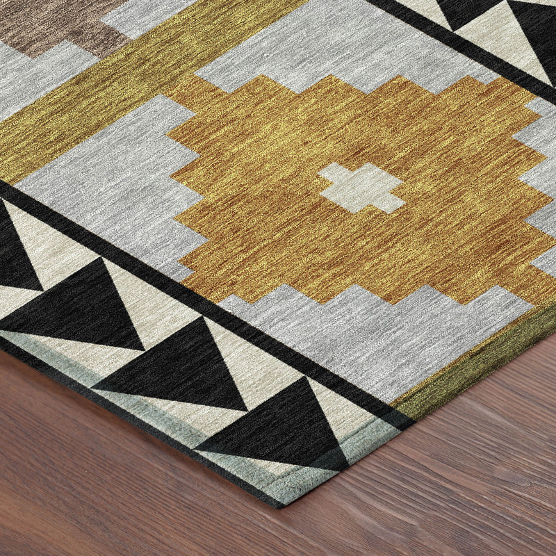 Geometric area rug corner view with mustard, beige, and gray blocks, plus black border trim