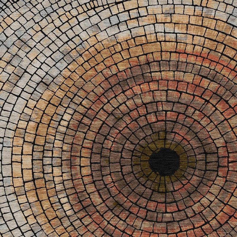 Geometric mosaic rug with circular pattern centered around a dark medallion, blue and copper