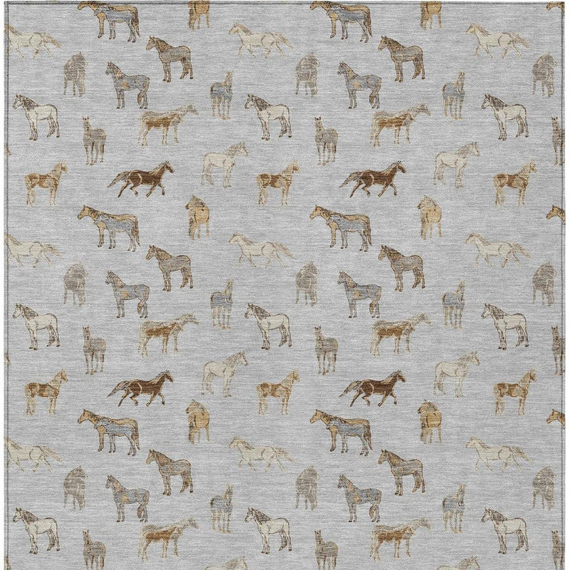 Close view of silver-gray rug with gold-beige horse pattern and scattered riders