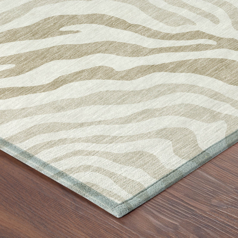 Ivory and beige zebra-print area rug corner with thin border and flat pile