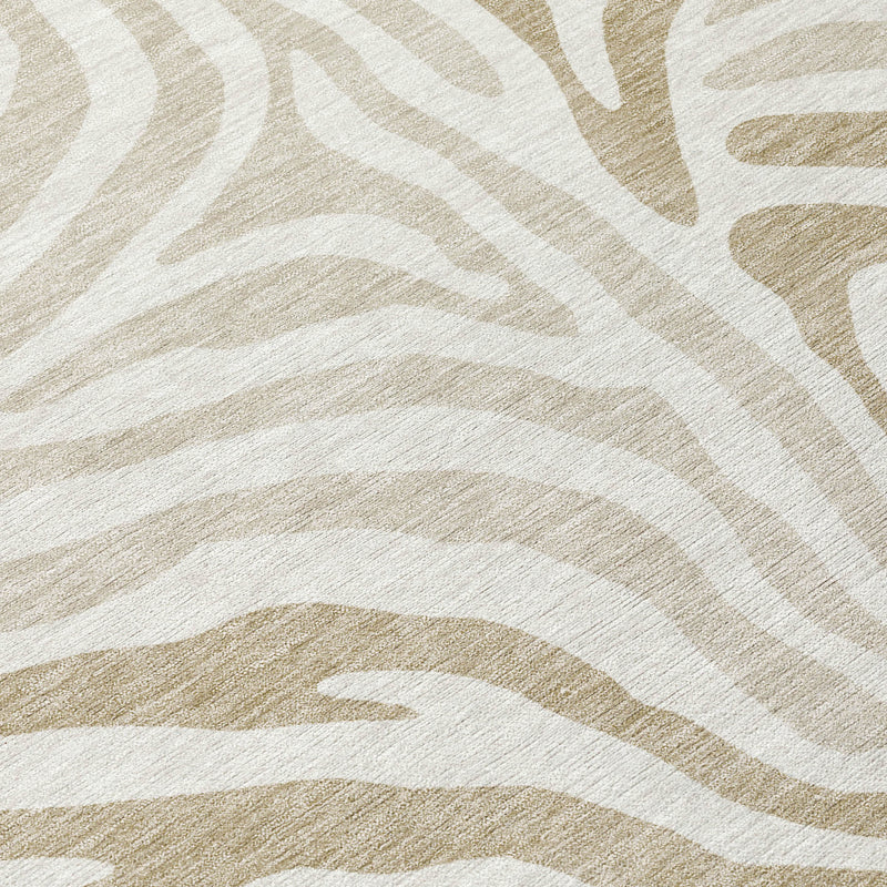 Close-up zebra-print area rug pattern in ivory with beige tones
