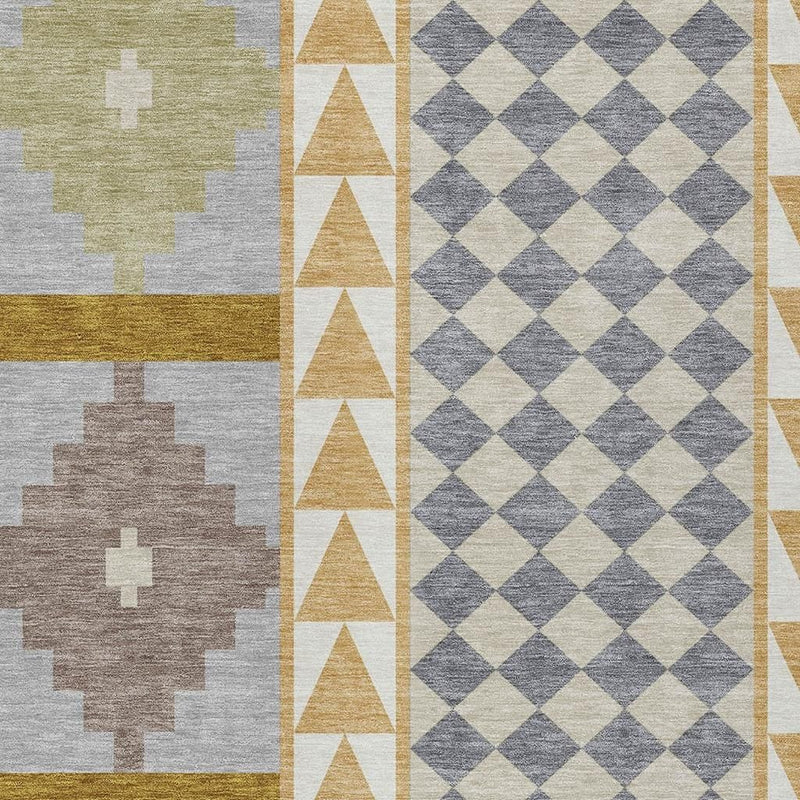 Area rug detail showing sage and gray medallion panels with tan border and blue-gray diamonds