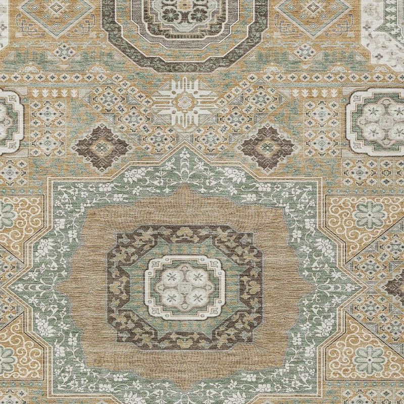 Close-up of area rug with sage, ivory, and gold medallion centerpiece and frame