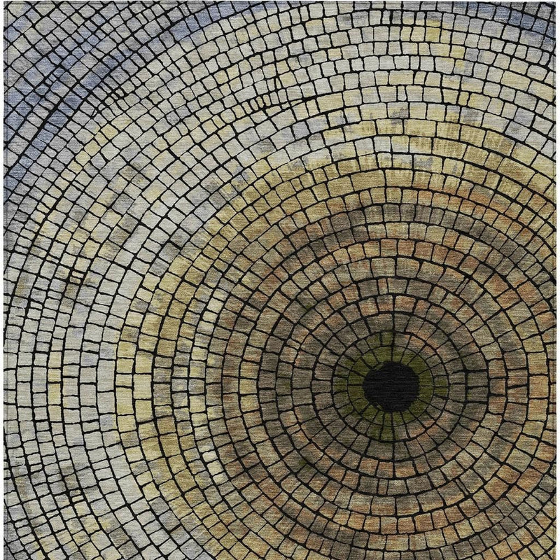 Geometric area rug featuring concentric mosaic circles with gold center and gray border