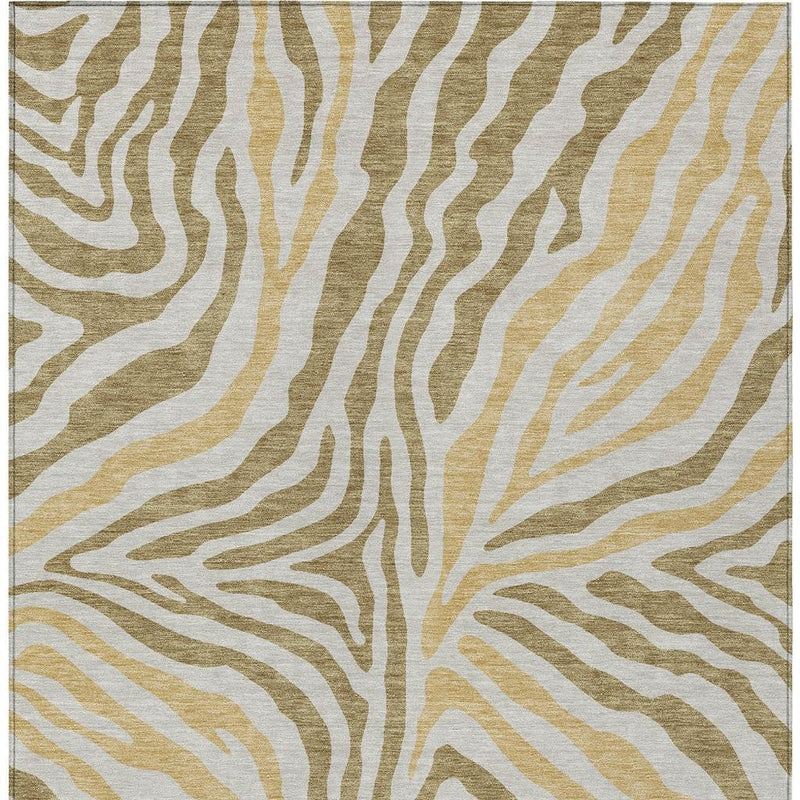 Walnut-and-gold zebra print area rug with light base and gold accents.