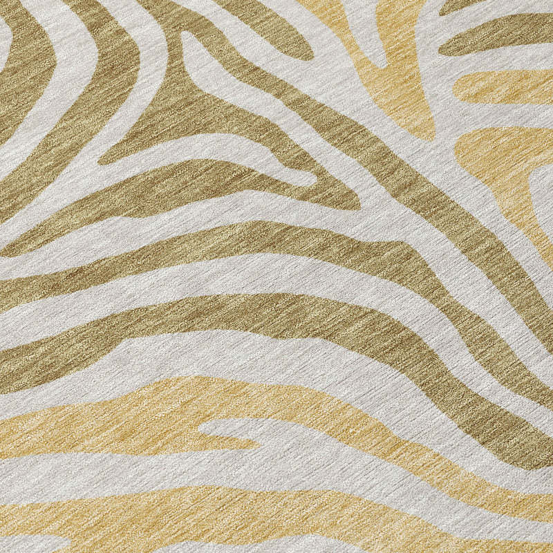 Walnut-and-gold zebra print area rug close-up, crisp line pattern.