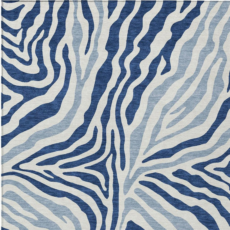 Navy and ivory zebra stripe area rug with dense, symmetrical wave design