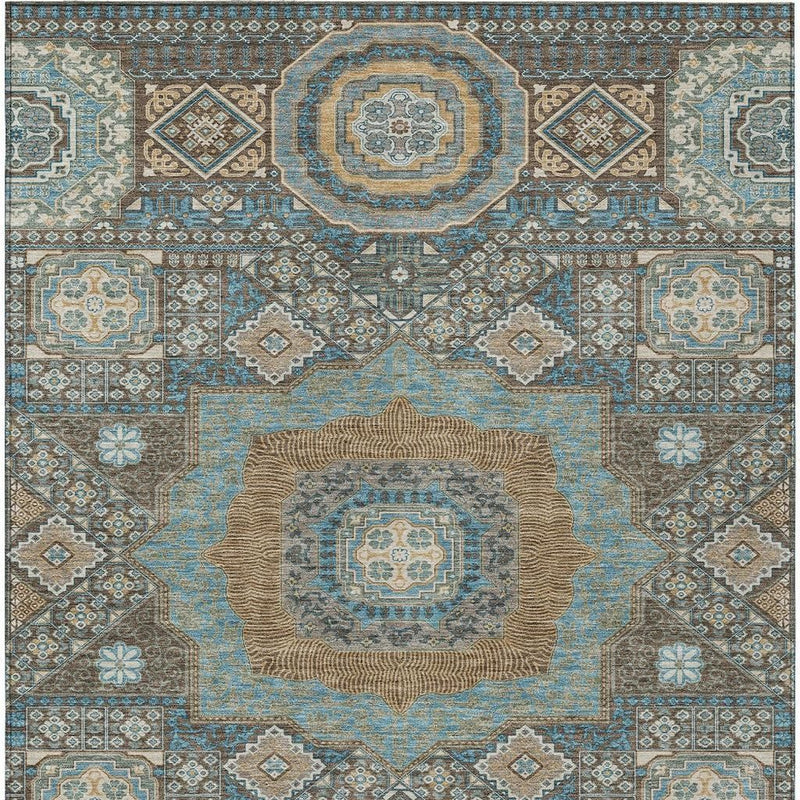 Blue and beige oriental area rug with central medallion and ornate geometric border