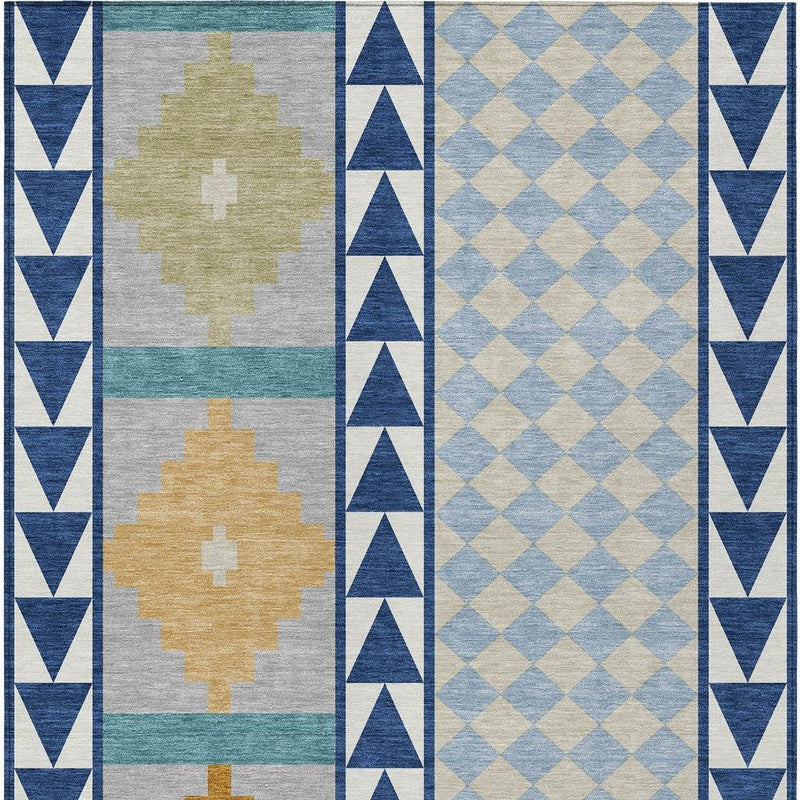 Area rug with navy border, teal and gray panels, and tan cross and diamond motifs