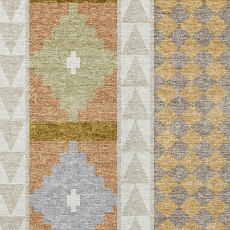 Close-up of beige, orange, green, and gray southwestern area rug blocks with white cross motifs