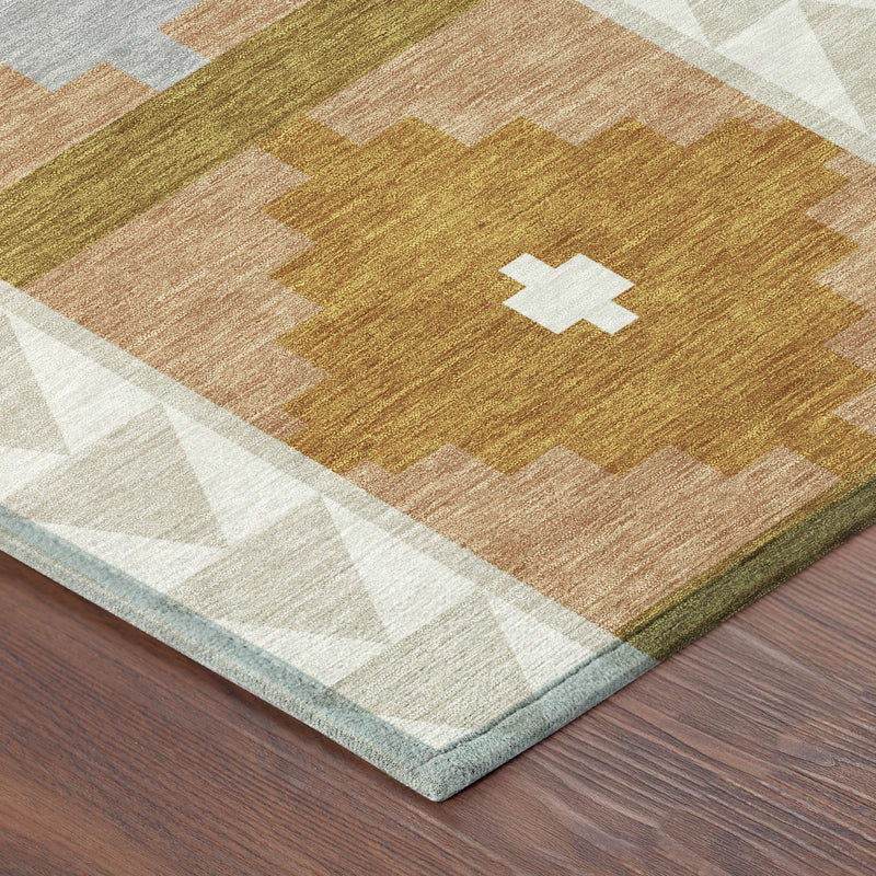 Corner of beige and orange area rug with southwestern motifs and bordered edge trim