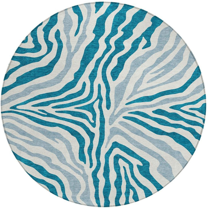 Round teal and ivory zebra stripe area rug with washable indoor/outdoor style