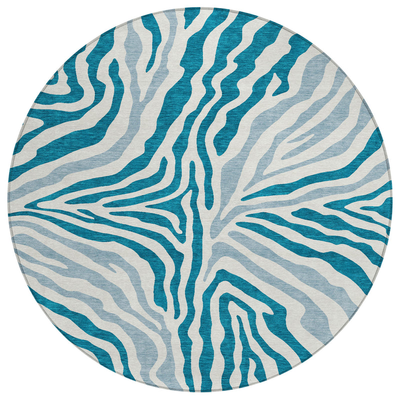 Round zebra print area rug in teal and ivory with washable indoor/outdoor design