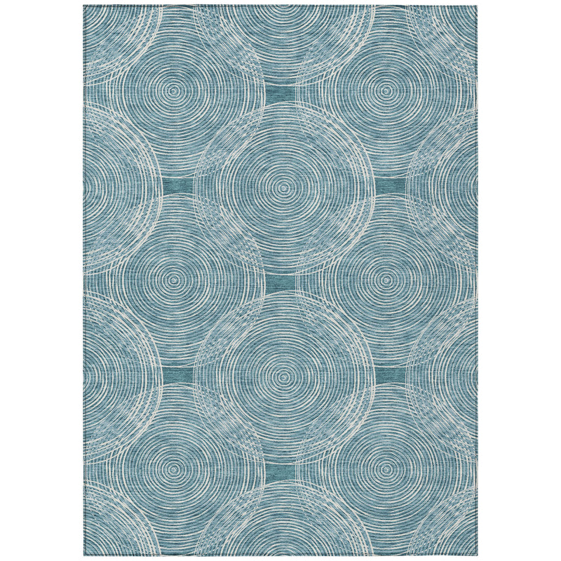 Teal blue geometric area rug with repeating circular motif and ivory cross-hatch grid
