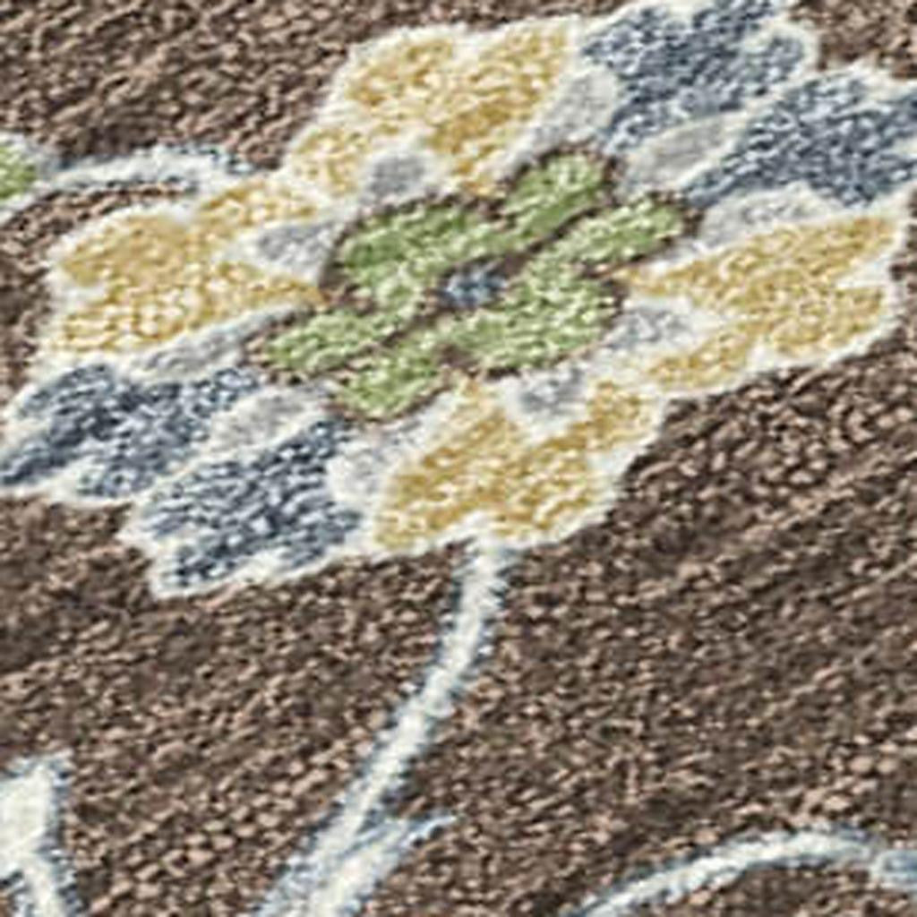 Multicolored floral area rug featuring blue, green, and yellow blooms on a textured brown background.