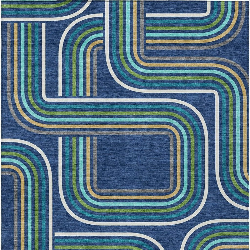 Navy blue geometric rug detail with aqua, green, gold, and white interlocking curves