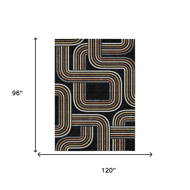 Black geometric area rug with ivory and warm-toned striped wave motif