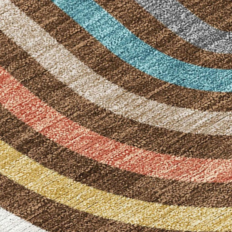 Textured close-up geometric wave rug with cream, teal, red, yellow, and brown stripes