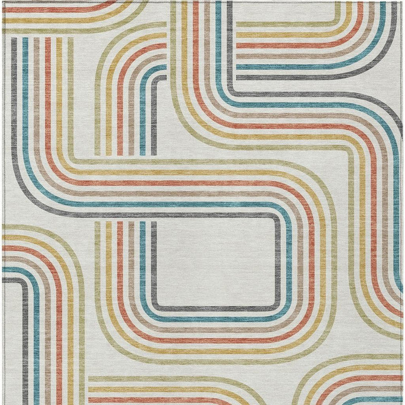 Ivory geometric area rug close-up with multicolor curved stripes and layered blocks