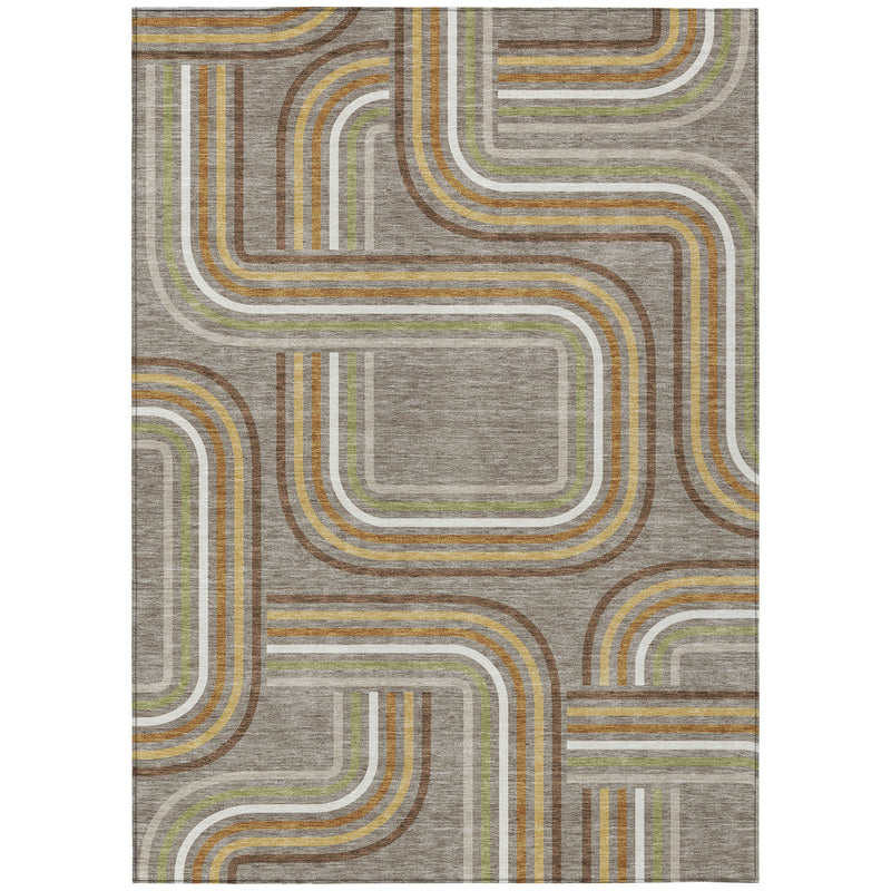 Geometric area rug close-up showing taupe ground with ivory, gold, green, and brown wavy blocks