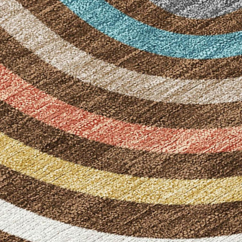 Close-up area rug weave with wavy multicolor stripes in brown, ivory, teal, coral, yellow