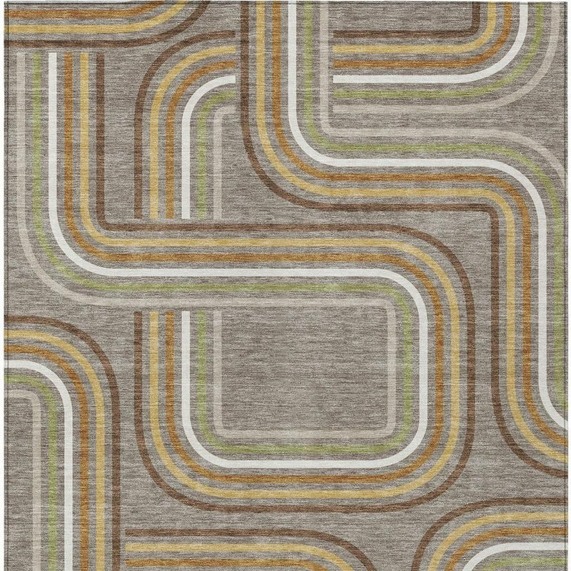 Geometric area rug close-up, taupe ground with ivory-outlined multicolor abstract blocks