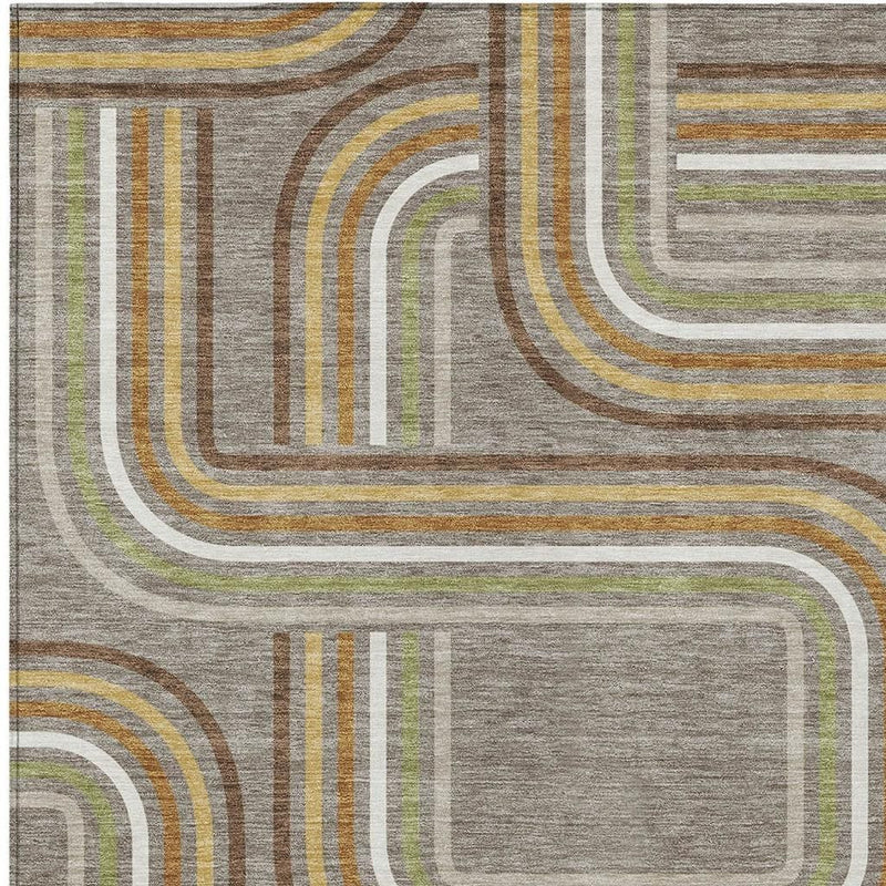Geometric area rug close-up, taupe ground with ivory-outlined stacked arch shapes